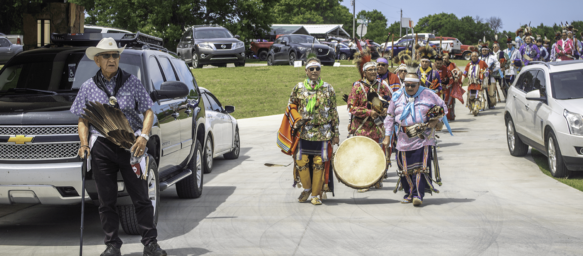 Drum warmers carrying in the drum along with the Grayhorse committee during the Grayhorse Inlonshka (2022). 